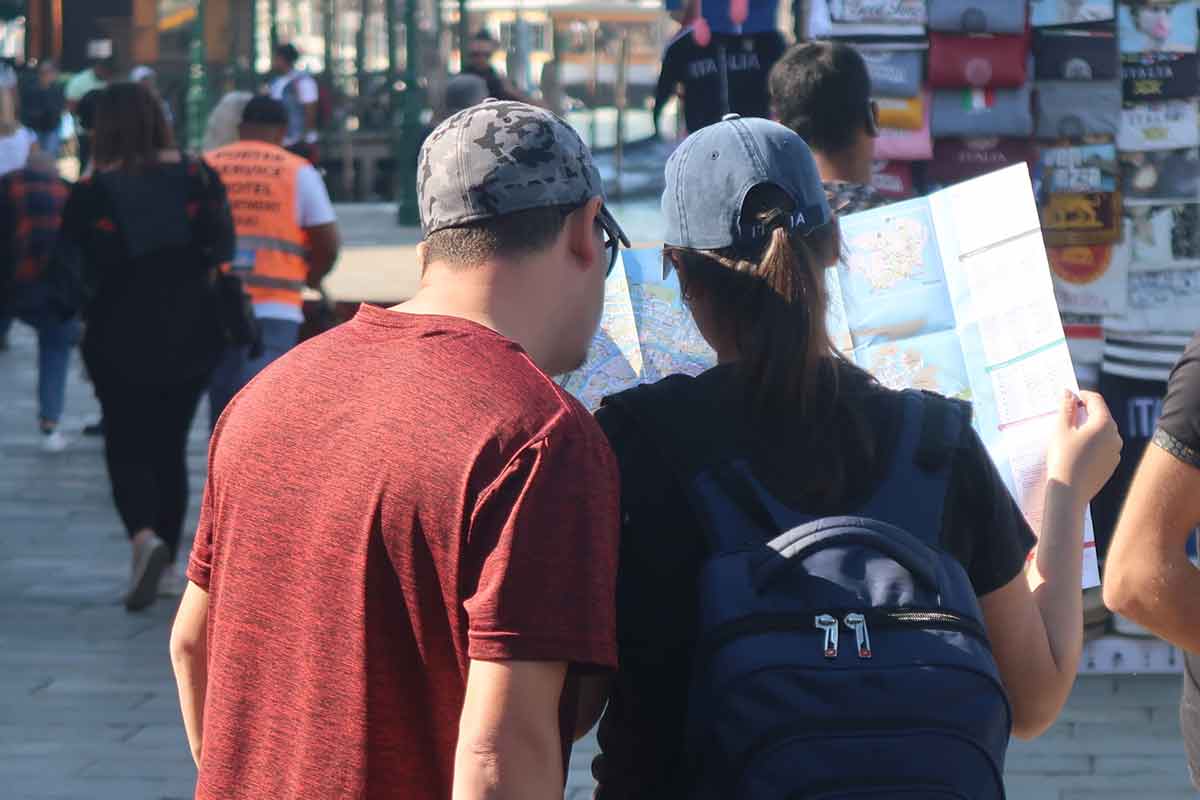 tourists looking at map in venice