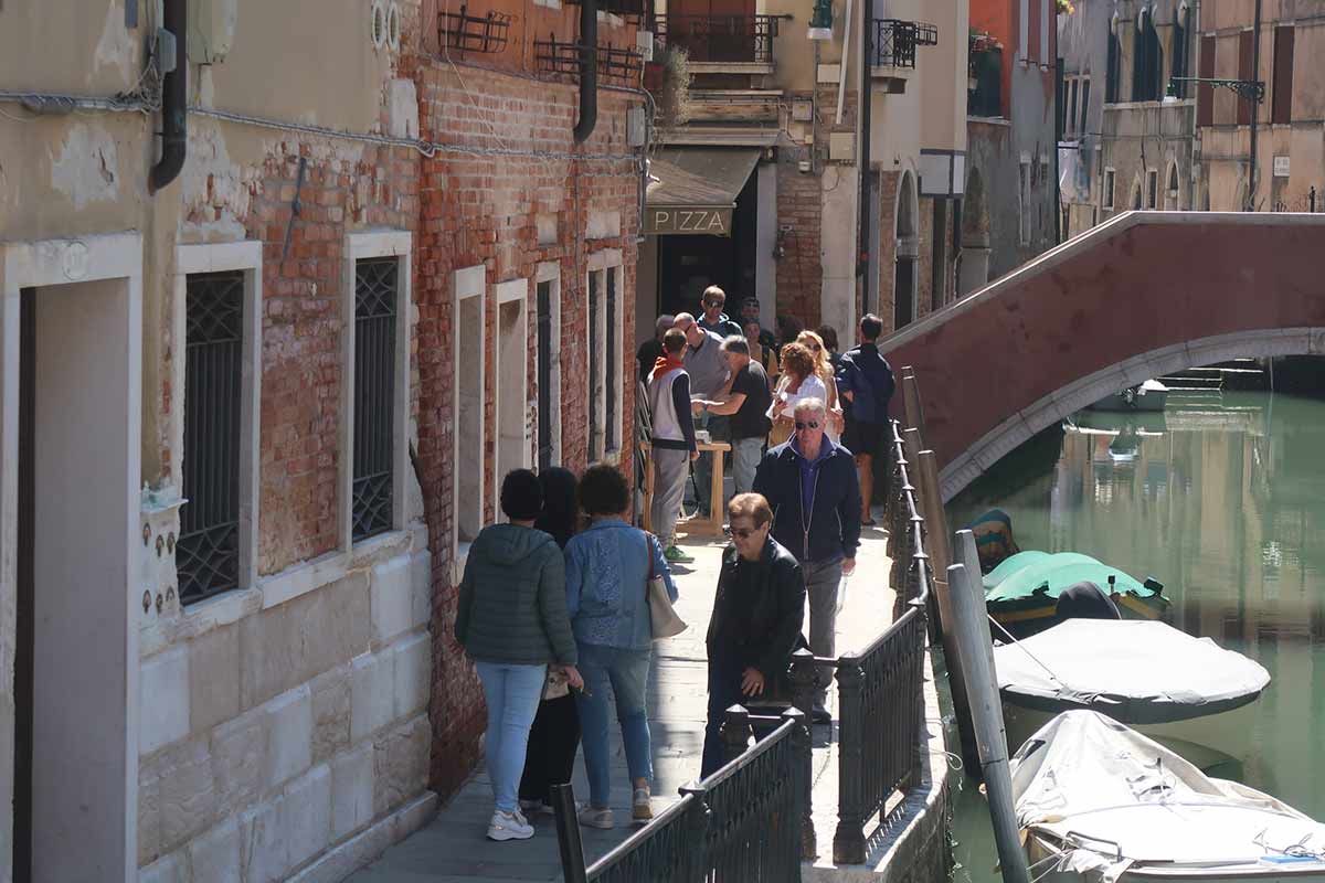 quiet street in venice with bridge